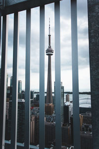 View of skyscrapers against cloudy sky