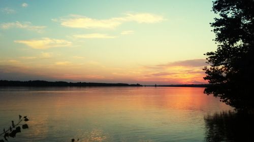 Scenic view of lake against sky during sunset