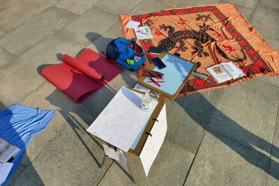 High angle view of multi colored chairs on table