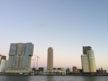 Skyscrapers in city against clear sky