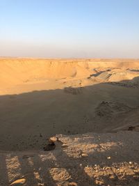 Scenic view of desert against clear sky