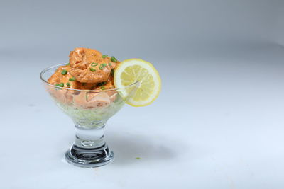 High angle view of drink in glass against white background