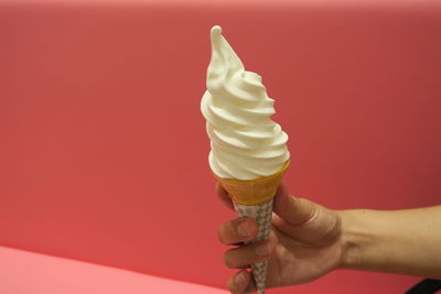 Cropped image of hand holding ice cream