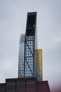 Low angle view of skyscraper against clear sky