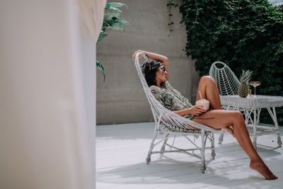 Woman sitting on chair at table