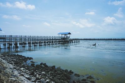 Pier over sea against sky