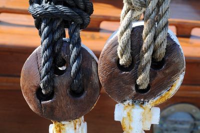 Close-up of rope tied to pulleys in boat