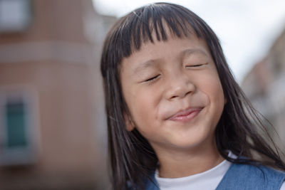 Close-up portrait of girl with eyes closed
