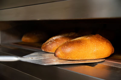 Fresh artisan bread only from the oven on a baking shovel. appetizing fresh and healthy bread