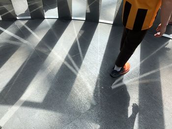 Low section of woman on tiled floor