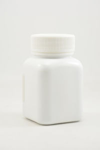 Close-up of bottle on white background