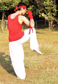 Rear view of man standing on field