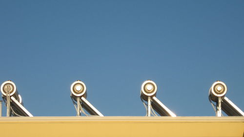 Low angle view of built structure against clear blue sky