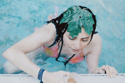 High angle view of woman swimming in pool