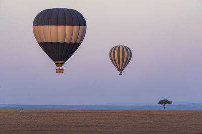 Hot air balloon flying over land