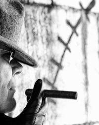 Close-up of man smoking cigar