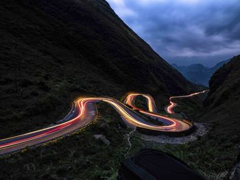 High angle view of light trails on road against sky