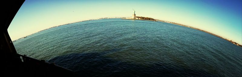 Scenic view of sea against blue sky