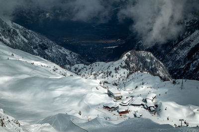 Beautiful environment and view from above to ski resort. scenic view of snow covered mountains.