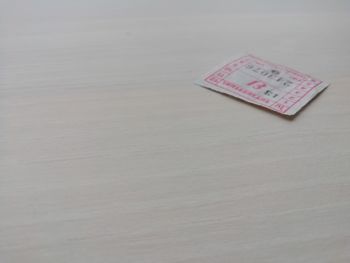 High angle view of text on paper on table