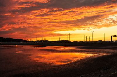 Scenic view of sea against romantic sky at sunset