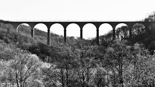 Arch bridge against clear sky