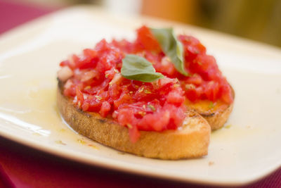 Close-up of bruschetta in plate on table