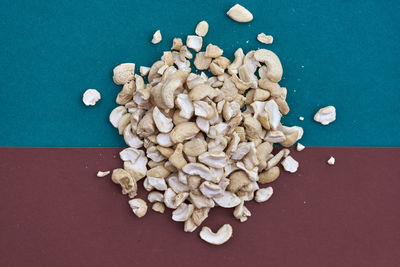 Directly above shot of cashews on colored background