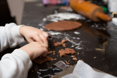 Cropped image of hand holding cookies