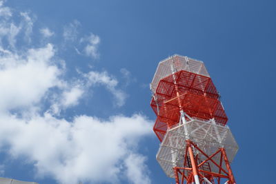 Low angle view of red tower against sky