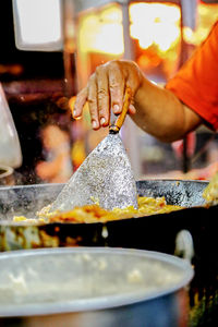 Close-up of man preparing food