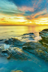 Scenic view of sea against sky during sunset