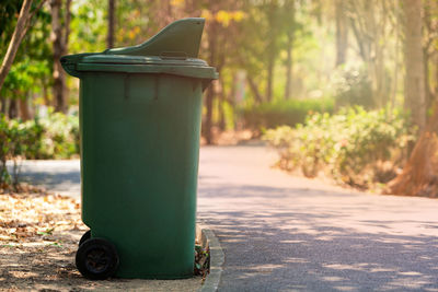 Close-up of garbage can on street