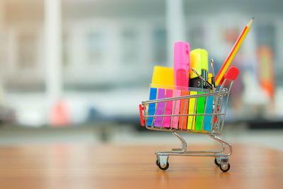 Close-up of office supply with miniature shopping cart