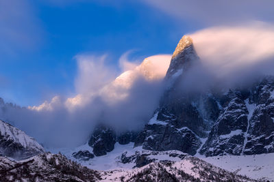 Scenic view of mountains against sky during winter