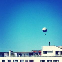 Low angle view of building against clear blue sky