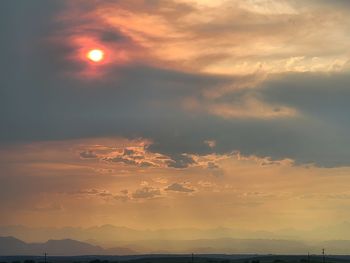 Scenic view of dramatic sky during sunset