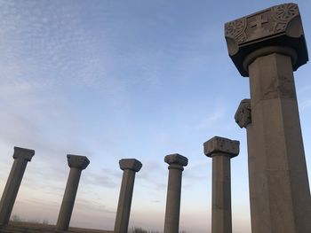 Low angle view of cross against blue sky