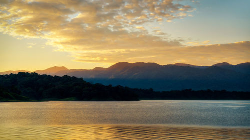 Scenic view of lake against sky during sunset