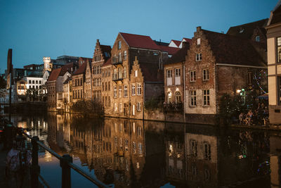 Reflection of buildings in city at night