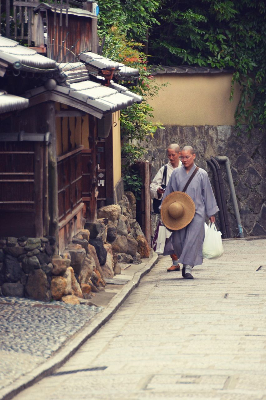 lifestyles, leisure activity, full length, casual clothing, men, sitting, building exterior, wood - material, built structure, architecture, day, togetherness, outdoors, house, rear view, childhood, steps