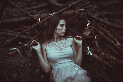 Young woman standing on tree