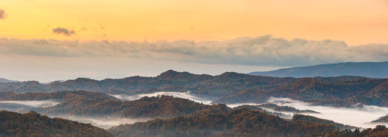 Panoramic view of mountains against sky during sunset