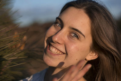 Close-up portrait of a smiling young woman