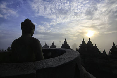 Panoramic view of temple building against sky during sunset