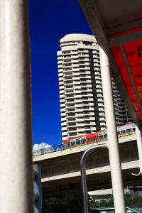 Low angle view of modern building against blue sky