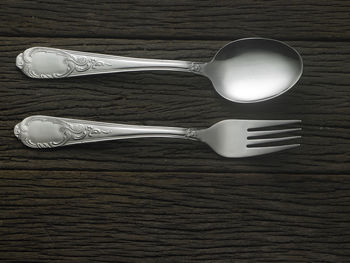 High angle view of fork and spoon on table