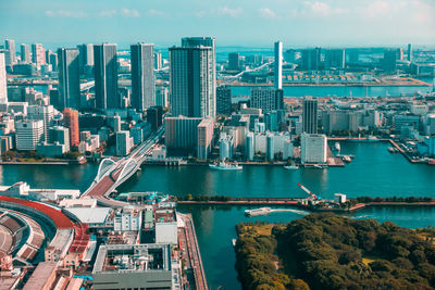 High angle view of city and buildings against sky