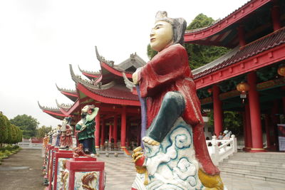 Statue against temple