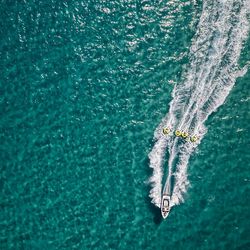 Aerial view of boat sailing on sea